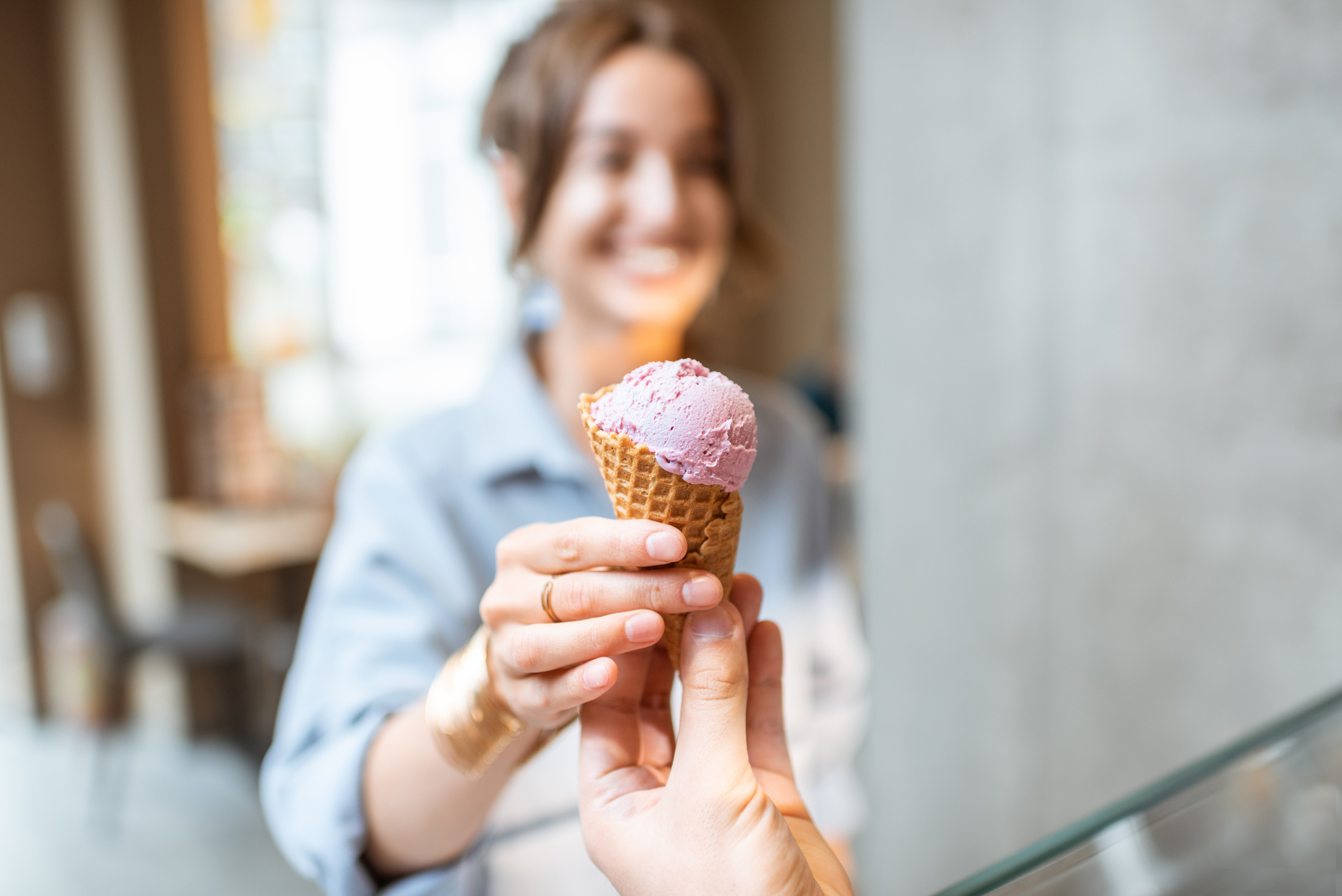 Woman Buying Ice Cream in the Shop